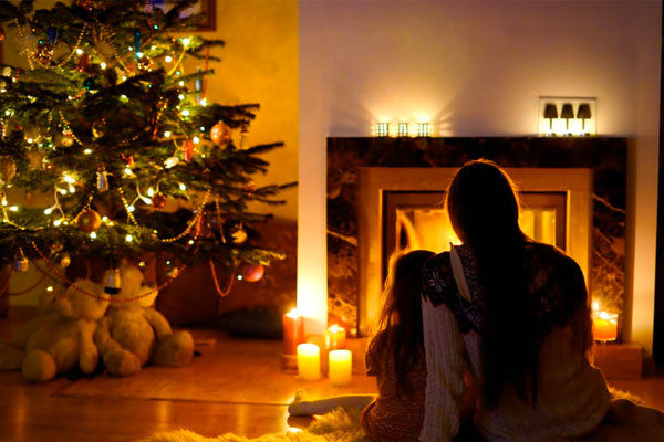 person sitting in front of the fire place