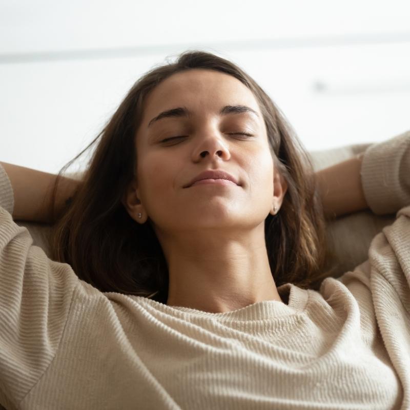 woman relaxing with eyes closed