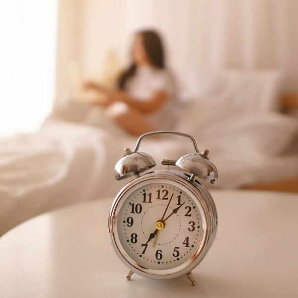 An alarm clock, helping a woman wake up in the morning 