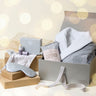 Home Retreat Collection gift box featuring a balm, bathrobe, and silk eye mask for ultimate relaxation.
