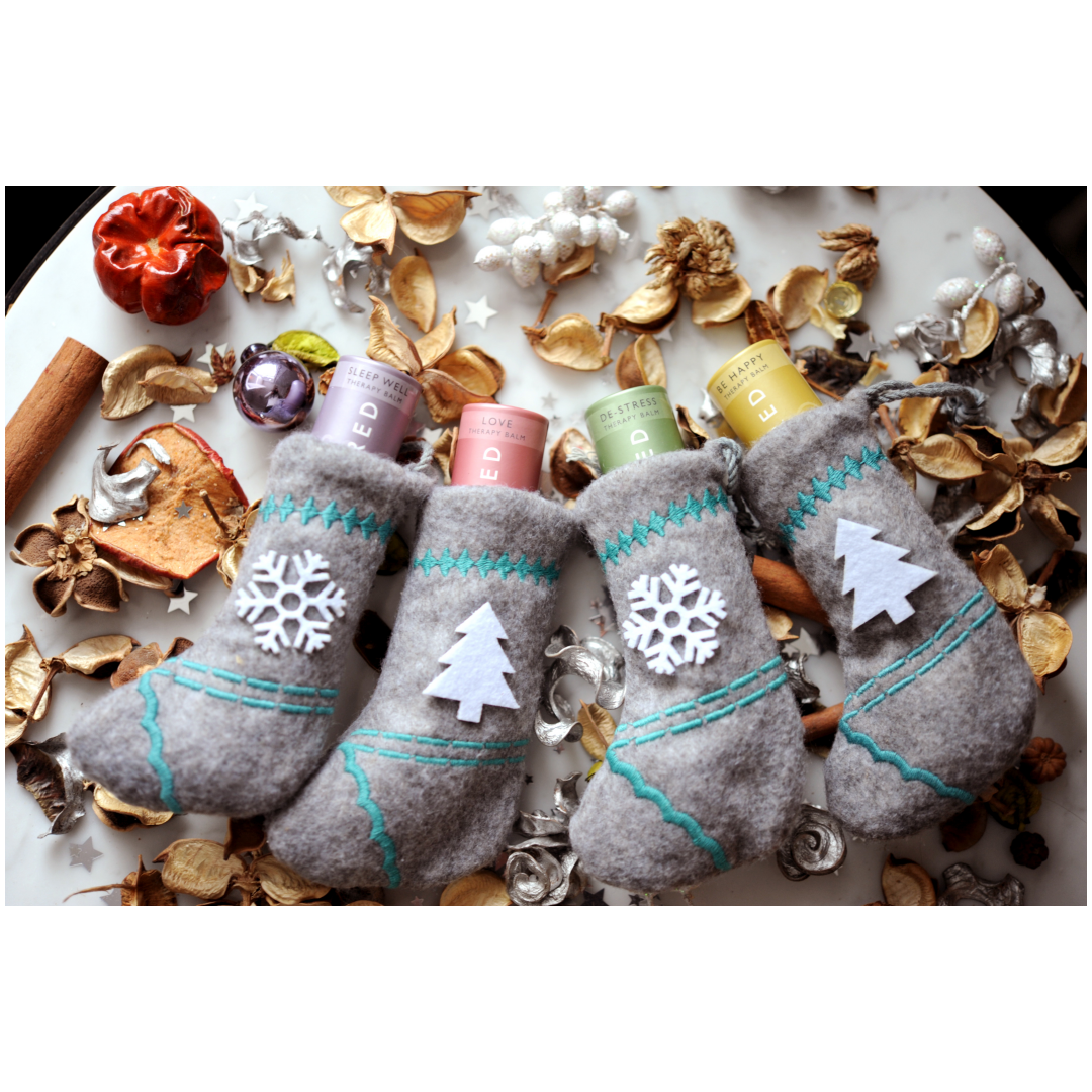 Soothing balm set with festive stocking packaging, designed for wellness enthusiasts.